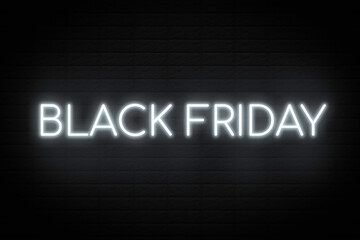 Black Friday neon on brick wall background.