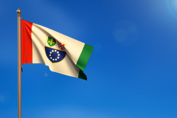 federation of bosnia and herzegovina. Flag blown by the wind with blue sky in the background.