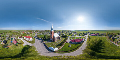 Fototapeta na wymiar full hdri 360 panorama aerial view on red brick neo gothic catholic church in countryside or village in equirectangular projection with zenith and nadir. VR AR content
