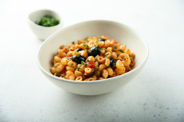 Homemade pasta puttanesca with fresh parsley