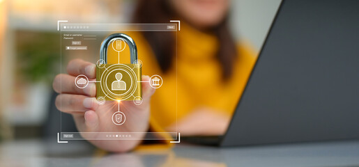 Cybersecurity concept. A person is holding onto a padlock containing a data privacy protection...