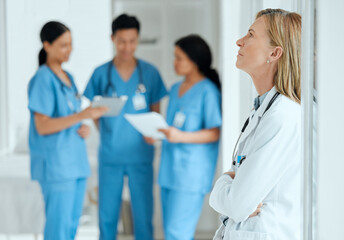 Burnout, anxiety or sad doctor in meeting with nurses with failure, stress or fatigue with medical...