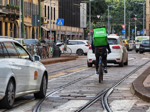 Uber Eats food delivery biker at work downtown Milan Italy May 10 2023