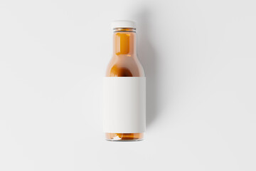 clear glass juice bottle