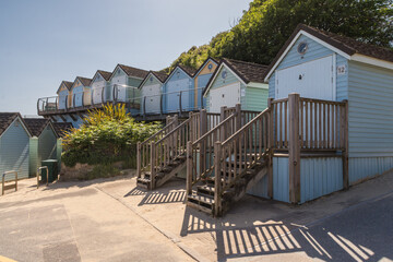 Bournemouth, UK - May 26th 2023: Colourful beach huts at Alum Chine Beach.