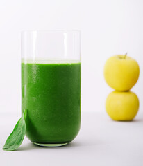 Glass of spinach detox juice with fruits