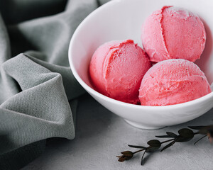Tasty strawberry ice-cream balls in bowl