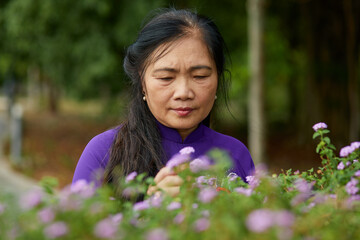 Vietnamese senior woman in the park.