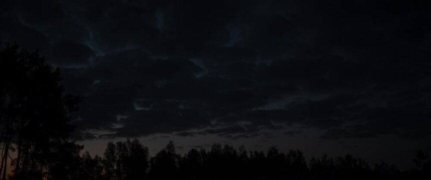 Timelapse of clouds over forest sunset anamorphic