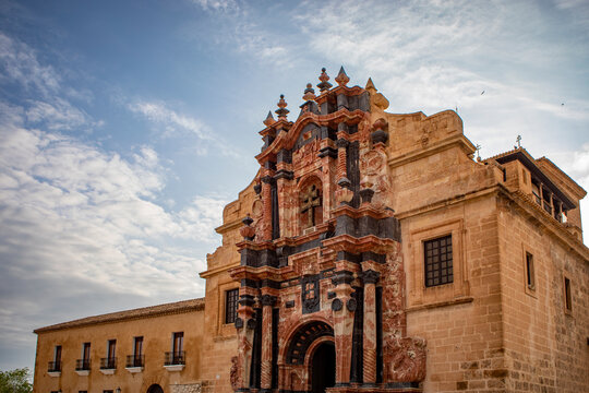 Facade of the Basilica de la Vera Cruz in Caravaca, Murcia, Spain, with red and black marble decorations, Baroque style