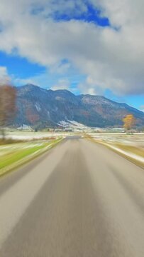 POV car trip across beautiful countryside, winter season, hyper lapse, vertical social media story