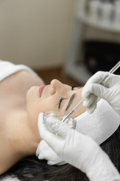 The photo reveals the magical world of facial skin peeling, where the skin gets a moment of recovery and rejuvenation in beauty salon at a cosmetologist. Reflects relaxing atmosphere peeling procedure