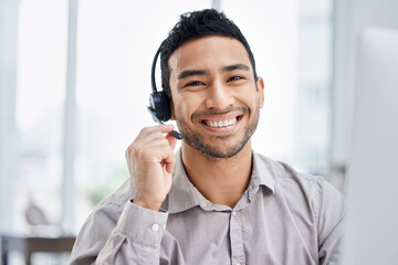Indian man, call center and portrait of working at office desk, computer or job in telemarketing,...