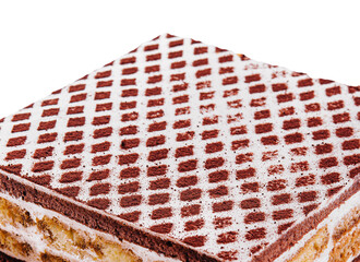 multi-layered Cocoa sponge cake isolated on white