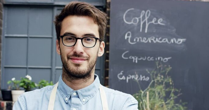 Face, cafe barista and man with glasses outdoor, pride for career or job at restaurant. Portrait, confidence and waiter, entrepreneur or business owner from Canada with success mindset at coffee shop