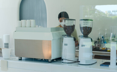 Barista making a espresso with a classic Italian coffee machine