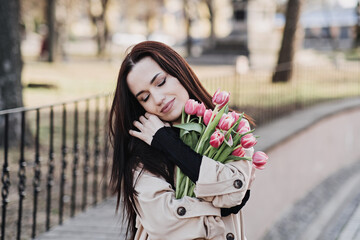 Self Care, Buy yourself flowers. Beautiful woman giving herself flowers and enjoying life outdoors...