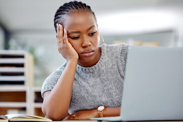 Mental health, businesswoman with a headache and laptop at her desk in a modern office workplace....