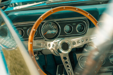 Steering wheel in a classic car, old automobile, vintage vehicle interior, wooden traditional cars...