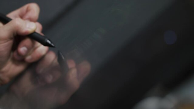 Professional Industrial artist designer working with interactive tablet pc pen. digital blueprint editing. ProRes stock footage