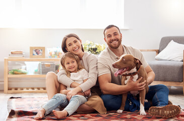 Mom, dad and portrait of kid with dog in living room for quality time, love and care together at...