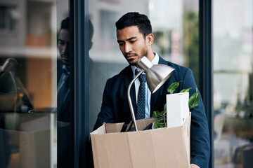 Depression, economy and a business man with a box walking outdoor in the city after being fired....