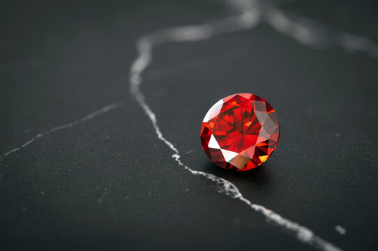 Red Ruby gemstone Round Cut on black background, close up shot