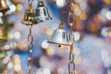 Christmas bell on bokeh background.