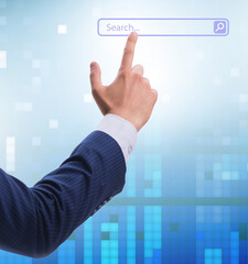 Search concept with businessman pressing button
