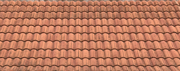 panorama of grunge antique roof clay tiles of thai temple or ancient house