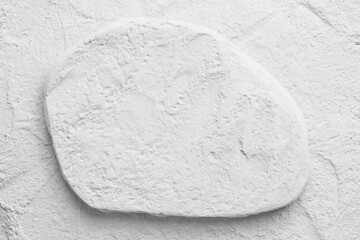 Decorative white putty background. Wall texture with filler paste applied with spatula, chaotic dashes and strokes over plaster.