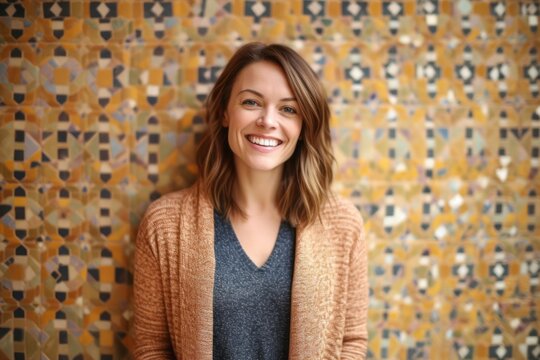 Fototapeta Medium shot portrait photography of a pleased woman in her 30s that is wearing a chic cardigan against a colorful mosaic or tile background . Generative AI