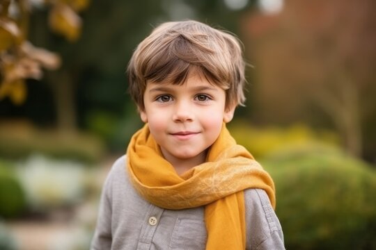 Medium shot portrait photography of a pleased child male that is wearing a charming scarf against a zen garden or tranquil background . Generative AI