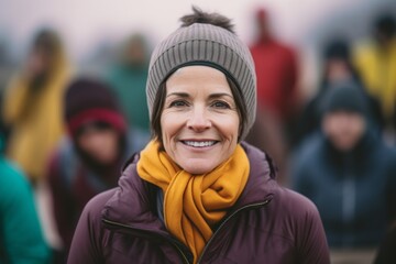 Portrait of smiling woman with friends in background on a cold winter day