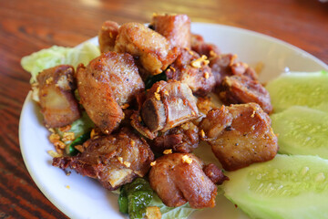 Deep fried pork ribs with garlic on the plate, Thai style food.