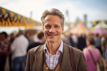 Portrait of handsome middle-aged man standing at oktoberfest