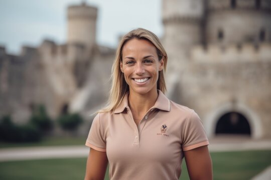 Medium shot portrait photography of a grinning woman in her 30s that is wearing a sporty polo shirt against a historic castle with knights and nobility background . Generative AI