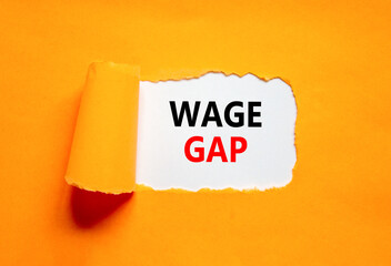 Wage gap symbol. Concept words Wage gap on beautiful white paper on a beautiful orange background....