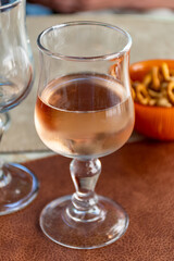 French cold rose dry wine from Provence in glass served for lunch in restaurant, Aigues-Mortes, Gard, France