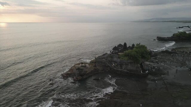 Aerial view of Tanah Lot, traditional Balinese temple at sunset, Beraban, Kediri, Tabanan Regency, Bali, Indonesia, South East Asia