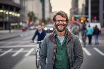 Fototapeta na wymiar Portrait of handsome hipster man with bicycle on the street in city