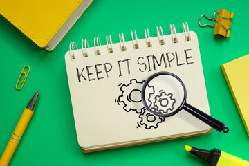 Keep it simple is shown using the text and photo of the magnifying glass