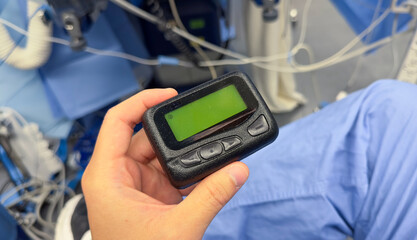 Beeper pager symbolizes communication, urgency, and efficiency in business and hospital settings. It represents the need for immediate response and coordination in professional environments