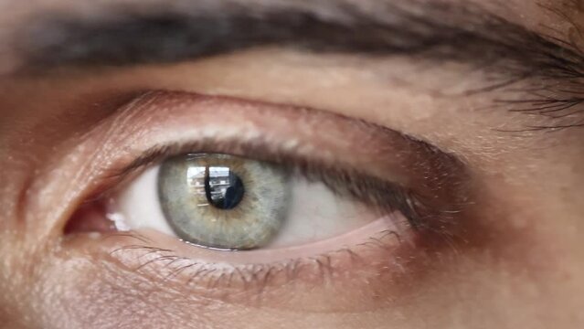 Close-up of young man's beautiful green eye