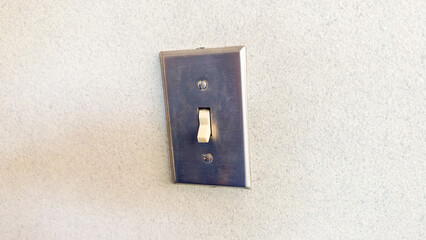 Light switch on and off symbolize control, illumination, and the power to change. They represent the ability to create or remove light, metaphorically representing decision-making and transformation