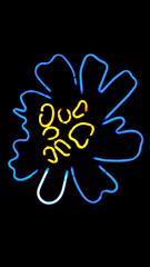 Artistic neon in the shape of a flower on a black background 