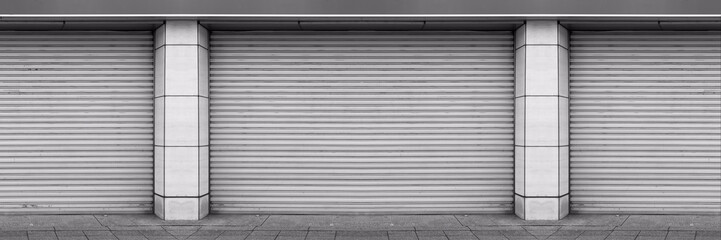 Steel shutter doors of warehouse, storage or storefront for steel door background and textured.