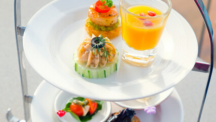 Beautifully served decorated lunch with different food snacks appetizers and starters and appetizers in outdoor cafe with sea view. European cuisine. Appetizer for wine