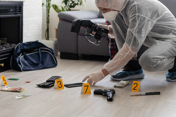 Criminological expert collecting evidence at the crime scene.