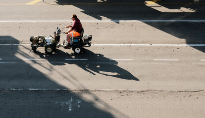 Antwerp, Belgium - 05 29 2023: A man engaged in the maintenance of the quay. Renewal of the lane....